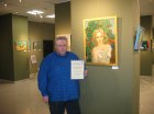 Alexey Akindinov with a certificate of honor at his painting \"Rose Fairy\". Opening of the exhibition \"Inspiration by Ornament-2024\". Lyubertsy Art Gallery, 02/03/2024.