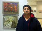 The gallery owner and the artist – Anatoly Znatnov at Alexey Akindinov\'s pictures. Opening of the anniversary Regional art exhibition \"Fall — 2015\" devoted to the 75 anniversary of the Ryazan organization of the Union of artists of Russia. 