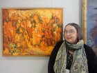 Margarita Budyliyova on the background of his work. The opening of the Jubilee Regional Art Exhibition \"Autumn - 2015\", dedicated to the 75th anniversary of the Ryazan branch of the Union of Artists of Russia. 