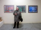 Tatiana Vlasova on the background of his paintings. The opening of the Jubilee Regional Art Exhibition \"Autumn - 2015\", dedicated to the 75th anniversary of the Ryazan branch of the Union of Artists of Russia. 