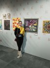 Veronika Fedotova at her painting \"Views\". International exhibition-competition \"World of Esotericism\", gallery \"Art-Commune\", Moscow, st. Kyiv, 2. Opening of the festival 04/15/2023.
