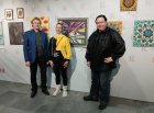 From left to right: Fyodor Filkov (Vice-President of the Eurasian Art Union); Veronika Fedotova; Alexey Akindinov, at the picture of Veronica - \"Views\". 