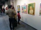 Spectators at Alexei Akindinov\'s painting \"The Rose Fairy\". International exhibition-competition \"World of Esotericism\", gallery \"Art-Commune\", Moscow, st. Kyiv, 2. Opening of the festival 04/15/2023.