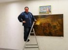 Alexey Akindinov hanging his personal exhibition \"Ornamental Reality\" at the Prio-Vneshtorgbank Art Gallery, Ryazan.