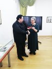 Chairman of the Russian Union of Professional Writers, Irina Ivanovna Manina (Moscow), presents the RSPL membership card to Alexey Akindinov. Meeting of the RSPL members. Ryazan Regional Universal Scientific Library named after Gorky. November 12, 20