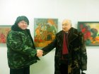 The architect – Eduard Maybaum congratulates Alexey Akindinov\'s handshake on participation in an exhibition (against Alexey\'s pictures). The exhibition \"A look at the artist Ryazan\", February 5, 2016. Showroom of the Union of artists of Russia, Ryaza