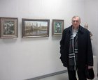 The artist – Nikolay Roslyakov against the pictures. The Spring 2015 exhibition devoted to the 70 anniversary of the Victory over fascism. Showroom of the Union of artists of Russia, Ryazan. April 23. Russia.