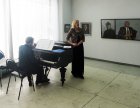 Musical performance: Marina Ovodkova (vocal), Evgeny Antipov (grand piano). At opening of the Spring 2015 exhibition devoted to the 70 anniversary of the Victory over fascism. Showroom of the Union of artists of Russia, Ryazan. April 23. Russia.