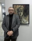 The artist – Vasily Koldin, against the picture. The Spring 2015 exhibition devoted to the 70 anniversary of the Victory over fascism. Showroom of the Union of artists of Russia, Ryazan. April 23. Russia.