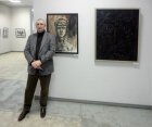 The director of the Ryazan art school of G. K. Wagner, the artist – Vasily Koldin at the pictures. The Spring 2015 exhibition devoted to the 70 anniversary of the Victory over fascism. Showroom of the Union of artists of Russia, Ryazan. April 23. Rus