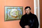Alexey Akindinov near his picture \"The First\" (a portrait of Yuri Gagarin).