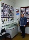Alexey Akindinov at the show-window devoted to his granduncle – to the colonel general Pavel V. Akindinov. Zakharovsky museum of local lore, opening of a personal exhibition of Alexey Akindinov \"My small Homeland\",