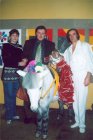 Alexey at the circus. From left to right: Lena, Alexey, burro and marmoset and air gymnast Valeriy Panushkin. 2003.