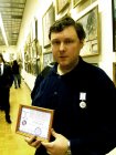 Alexey Akindinov with a medal «Talent and Calling» and the certificate to it. CHA. Moscow. 29.12.09.